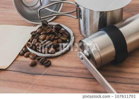 Coffee beans and coffee mill close-up material Coffee beans and coffee mill close-up material 107611701