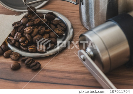 Coffee beans and coffee mill close-up material Coffee beans and coffee mill close-up material 107611704