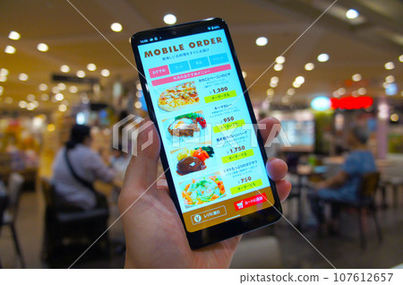 Mobile order food at the food court Mobile order food at the food court 107612657