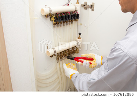 Inspection, maintenance, and repair image of residential hot water floor heating equipment 107612896
