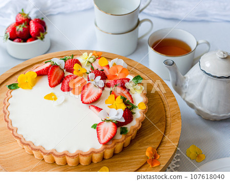 Home party with tea and fruit tarts 107618040