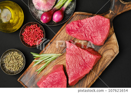 Flat lay composition with raw strip steak boneless Flat lay composition with raw strip steak boneless 107621654
