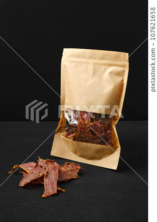 Dehydrated lamb jerky in paper pack Dehydrated lamb jerky in paper pack 107621658