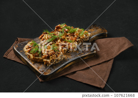 Sandwich with mushrooms on black background 107621668