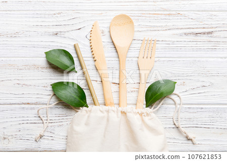 Eco friendly reusable recyclable white eco bag with kitchenware on Colored background. Concept zero waste Eco friendly reusable recyclable white eco bag with kitchenware on Colored background. Concept zero waste 107621853
