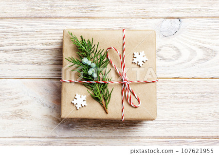Gift box with red ribbon over white wooden background Gift box with red ribbon over white wooden background 107621955