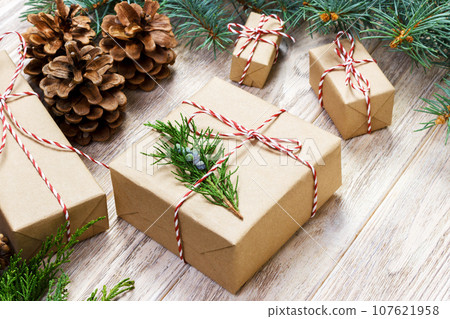 wrapping gifts concept for holiday on white background top view mock up 107621958