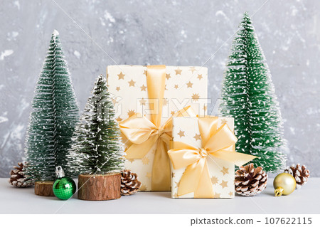 Christmas composition. craft Gift box, small tree, branches and craft DIY decorations on white background. New year concept. Christmas home decoration Flat lay, top view, copy space Christmas composition. craft Gift box, small tree, branches and craft DIY decorations on white background. New year concept. Christmas home decoration Flat lay, top view, copy space 107622115