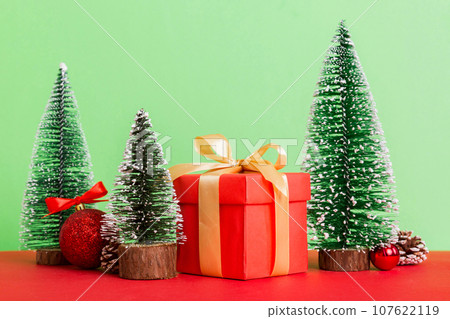 Christmas composition. craft Gift box, small tree, branches and craft DIY decorations on white background. New year concept. Christmas home decoration Flat lay, top view, copy space 107622119
