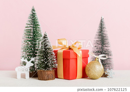 Christmas composition. craft Gift box, small tree, branches and craft DIY decorations on white background. New year concept. Christmas home decoration Flat lay, top view, copy space 107622125