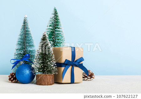 Christmas composition. craft Gift box, small tree, branches and craft DIY decorations on white background. New year concept. Christmas home decoration Flat lay, top view, copy space Christmas composition. craft Gift box, small tree, branches and craft DIY decorations on white background. New year concept. Christmas home decoration Flat lay, top view, copy space 107622127