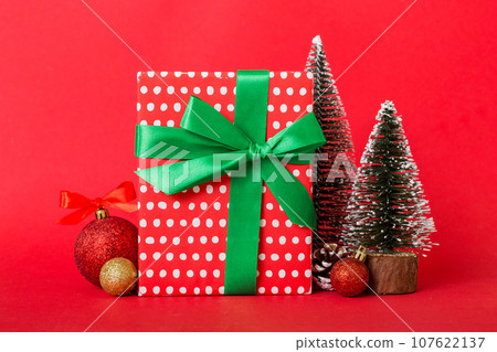 Christmas composition. craft Gift box, small tree, branches and craft DIY decorations on white background. New year concept. Christmas home decoration Flat lay, top view, copy space Christmas composition. craft Gift box, small tree, branches and craft DIY decorations on white background. New year concept. Christmas home decoration Flat lay, top view, copy space 107622137