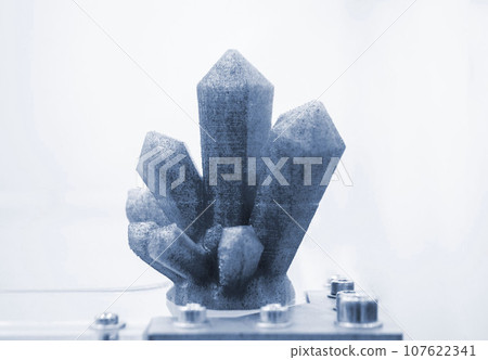 Art objects printed on 3D printer. Model printed on 3D printer from melted plastic. Objects printed close-up. Concept new modern innovation printing technology. Additive new printer technology Art objects printed on 3D printer. Model printed on 3D printer from melted plastic. Objects printed close-up. Concept new modern innovation printing technology. Additive new printer technology 107622341
