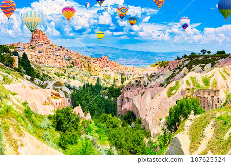 Fly of air balloons in Unique natural place - Cappadocia , Turkiye. Fly of air balloons in Unique natural place - Cappadocia , Turkiye. 107625524