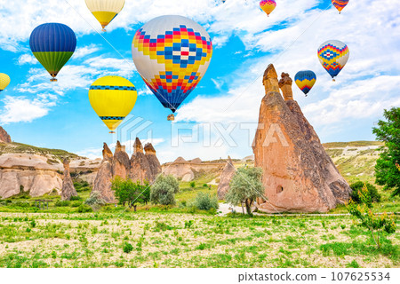 Fly of air balloons in Unique natural place - Cappadocia , Turkiye. Fly of air balloons in Unique natural place - Cappadocia , Turkiye. 107625534