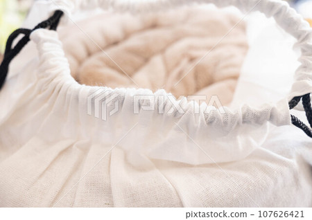 Fluffy blanket stored in a storage bag Fluffy blanket stored in a storage bag 107626421
