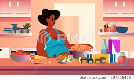 happy pregnant woman future mom cooking at home pregnancy motherhood expectation concept modern kitchen interior 107626438