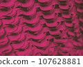 Red fuchsia color abstract background, bicycle chain 107628881