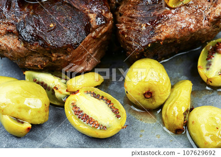 Grilled ostrich steak with kiwi sauce 107629692