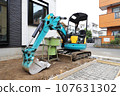 Excavator at a house construction site 107631302