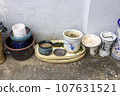 A terrace scene with a variety of pots 107631521