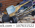 A warehouse piled with clutter such as cleaning tools and dumbbells 107631522