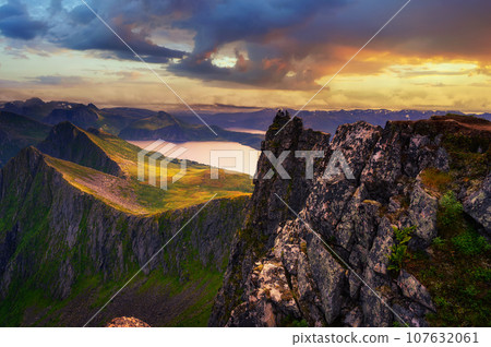 Sunset above the Husfjellet Mountain on Senja Island in northern Norway 107632061