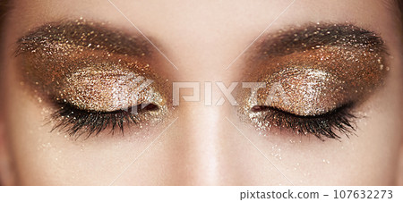 Female eye with long false eyelashes Female eye with long false eyelashes 107632273
