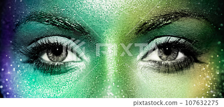 Beautiful female eyes with sparkles on her face 107632275