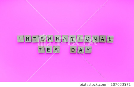 December 15, International Tea Day, minimalistic banner with the inscription in wooden letters 107633571