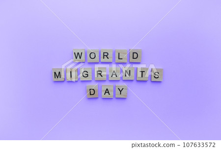 December 18, International Migrants Day, minimalistic banner with the inscription in wooden letters December 18, International Migrants Day, minimalistic banner with the inscription in wooden letters 107633572