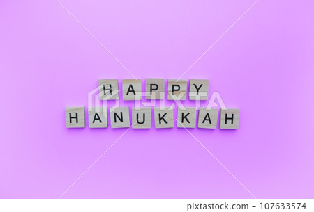 December 18-26, Hanukkah, minimalistic banner with the inscription in wooden letters December 18-26, Hanukkah, minimalistic banner with the inscription in wooden letters 107633574