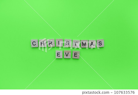 December 24, Christmas Eve, minimalistic banner with the inscription in wooden letters 107633576