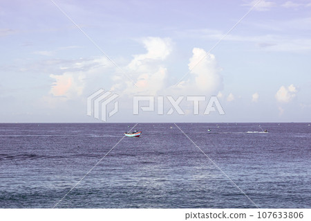 Sea sky cumulus cloud landscape view background. Calm water alone fishing boat. Destination aim progress concept 107633806