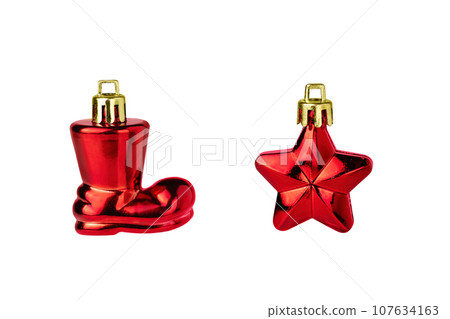 Red Christmas ornament isolated on white background for design. Christmas ornament in a shape of star and Santa Clause shoe. 107634163