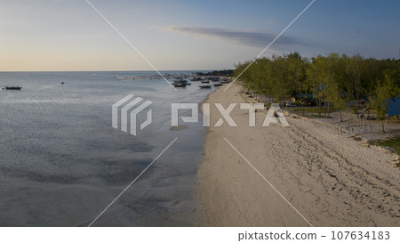 Beautiful aerial view of wooden fisherman boats at Kendwa village at sunset Beautiful aerial view of wooden fisherman boats at Kendwa village at sunset 107634183