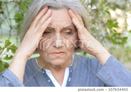 Close up portrait of unhappy senior woman 107634403