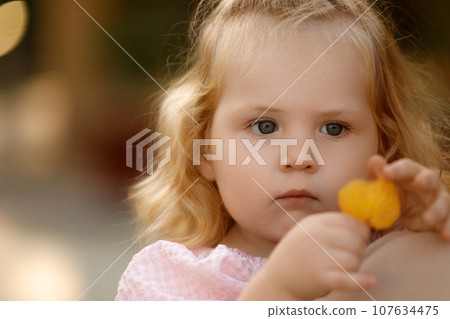 Mother and child,cute little girl resting on her Mother and child,cute little girl resting on her 107634475
