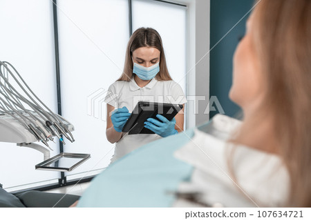 The patient provides the dentist with complete information about his complaints about dental health. The patient learns about the recommended treatment plan and possible methods of correcting the The patient provides the dentist with complete information about his complaints about dental health. The patient learns about the recommended treatment plan and possible methods of correcting the 107634721