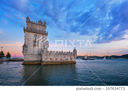 Belem Tower or Tower of St Vincent - famous tourist landmark of Lisboa and tourism attraction - on the bank of the Tagus River (Tejo) in evening dusk after sunset with dramatic sky. Lisbon, Portugal Belem Tower or Tower of St Vincent - famous tourist landmark of Lisboa and tourism attraction - on the bank of the Tagus River (Tejo) in evening dusk after sunset with dramatic sky. Lisbon, Portugal 107634773