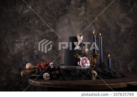 Halloween still life with skull, bones and cake 107635789
