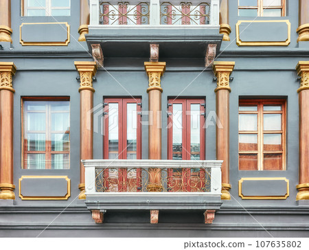 Street view of an old colonial building facade, architecture background, Cuenca, Ecuador. 107635802