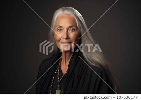 woman in her 60s against a plain background 107636177