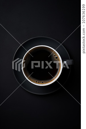 Black cup of coffee on black background. Top view Black cup of coffee on black background. Top view 107636199