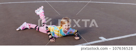 A little girl fell on roller skates. Learns to ride. A little girl fell on roller skates. Learns to ride. 107636528