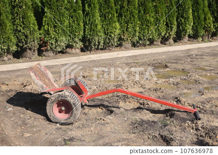 Garden wheelbarrow with a flat platform for transporting plants and conifers, a nursery? 107636978
