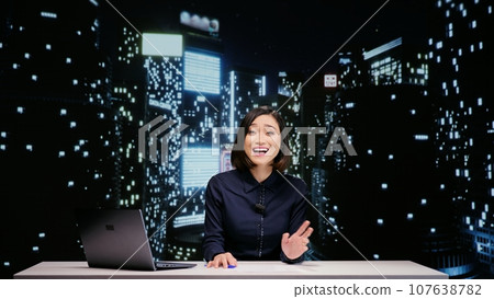 Anchorwoman presents night talk show late, addressing all breaking news topics on live television. Media journalist hosting entertainment show for international tv content, global communications. 107638782