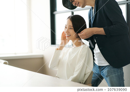 hair salon hairdresser and customer 107639090