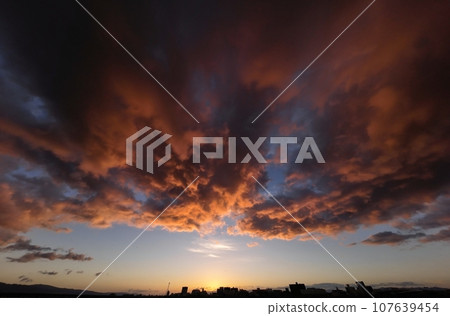Late autumn dawn sky with dramatic sunrise over powerful clouds, ultra-wide angle, sky-based, 231002am 107639454