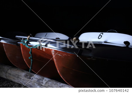 Boats on the lake at night 107640142